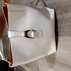 Dooney and Bourke large white tote.   Can also be a shoulder bag. Has a wallet.